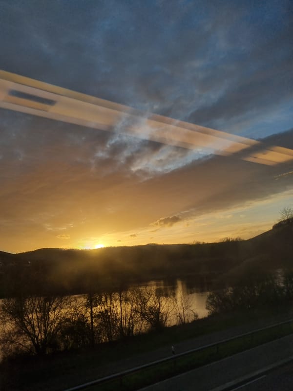 Sunset reflection and restaurant exterior documented in Saarburg