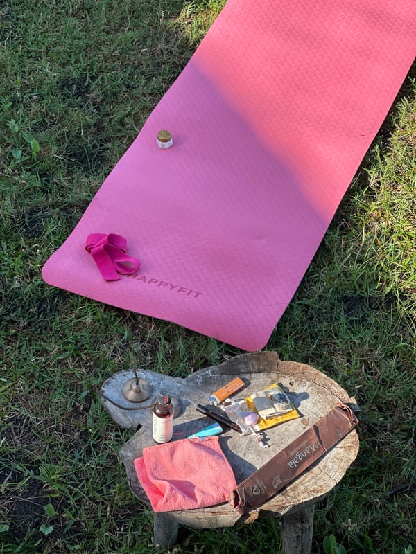 Women practice beach yoga in Mendoyo garden setting
