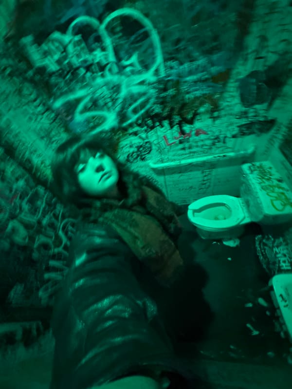 Person documented in graffiti-covered room in New York