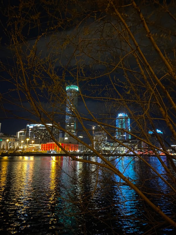Nighttime photography session documents Yekaterinburg waterfront reflections