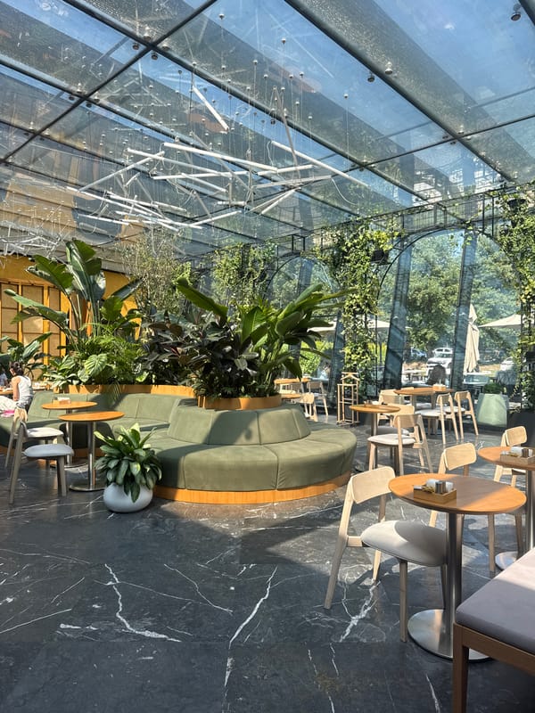 Morning coffee stop at a plant-filled glass-ceiling café in Almaty