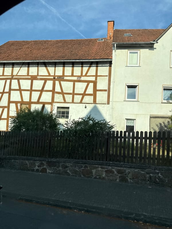 Street-level look at Kröffelbach's mix of old and new architecture