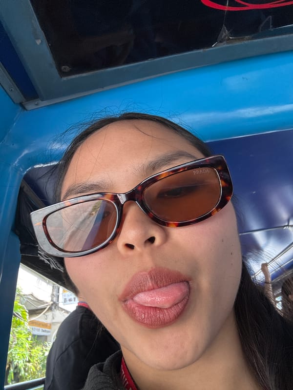 Person in Prada sunglasses poses playfully in Davao City