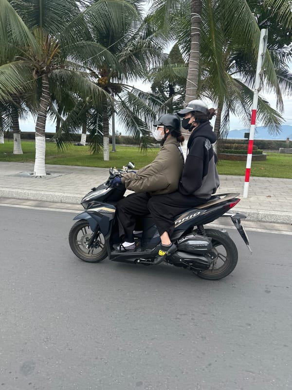 Motorcycle convoy with flags travels through Nha Trang