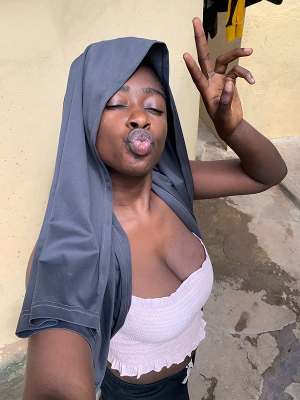 Woman poses playfully for photos in Rafin Par, Nigeria