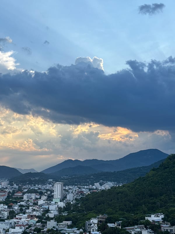 Crepuscular rays break through storm clouds over coastal Nha Trang