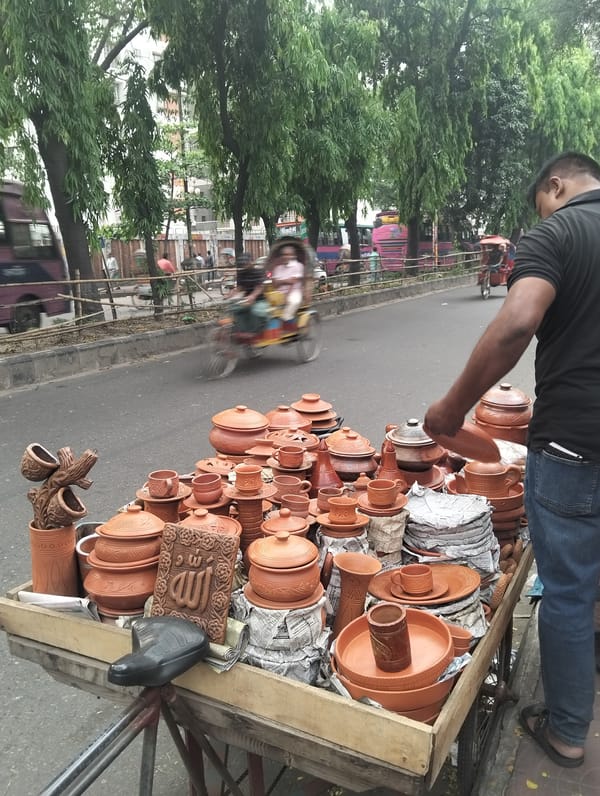 Street vendors operate during busy morning in Dhaka