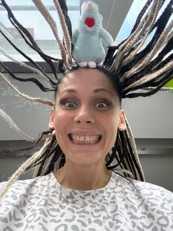 Woman poses with plush toy, peace lily in Rusanovo