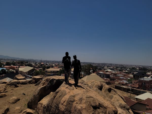Residents gather on Jos rock formations for city overlook photos