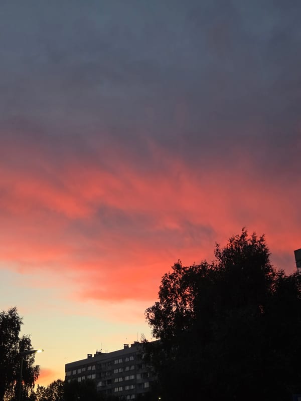 Szczecin skyline in silhouette under a colorful summer sunset