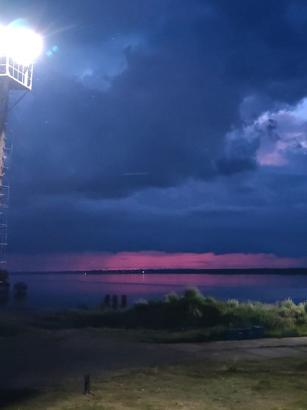Aboard a river vessel at Rybinsk under a stormy twilight sky