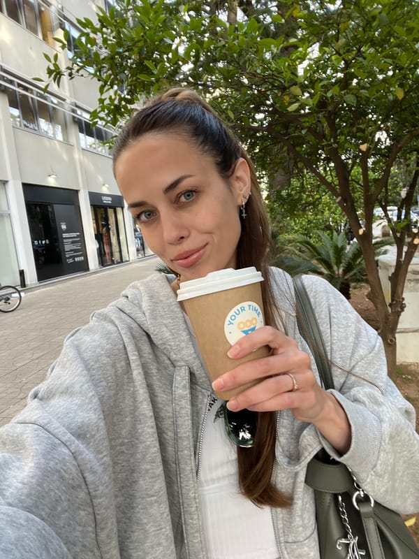 Woman with coffee spotted outside Legend building in Bar