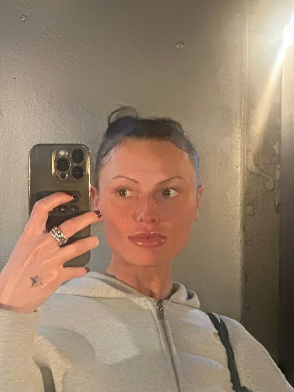 Woman takes bathroom selfie in London