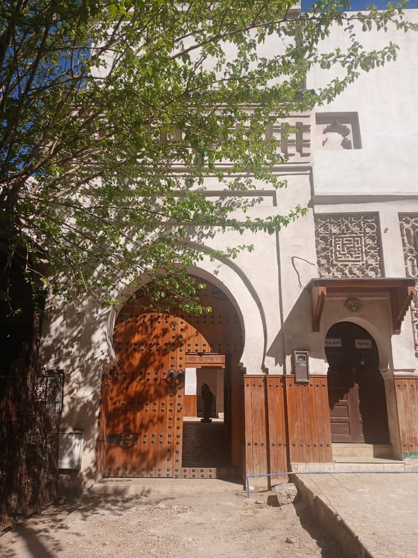 Tourist documentation of historic Meknes medina architecture and street life