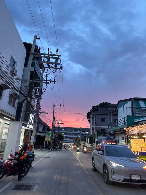 Nong Prue streets at sunset, sky shifting blue to pink