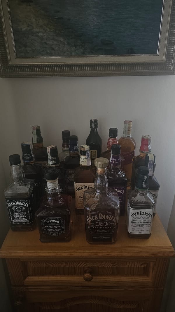 Whiskey collection displayed on wooden furniture in Bulgarian town