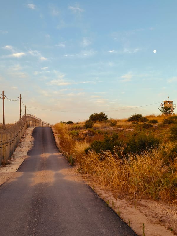 Rural sunset documentation includes security fences in Lachish Council