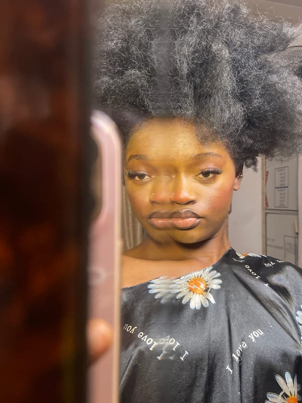 Woman takes multiple mirror selfies in floral robe in Ado
