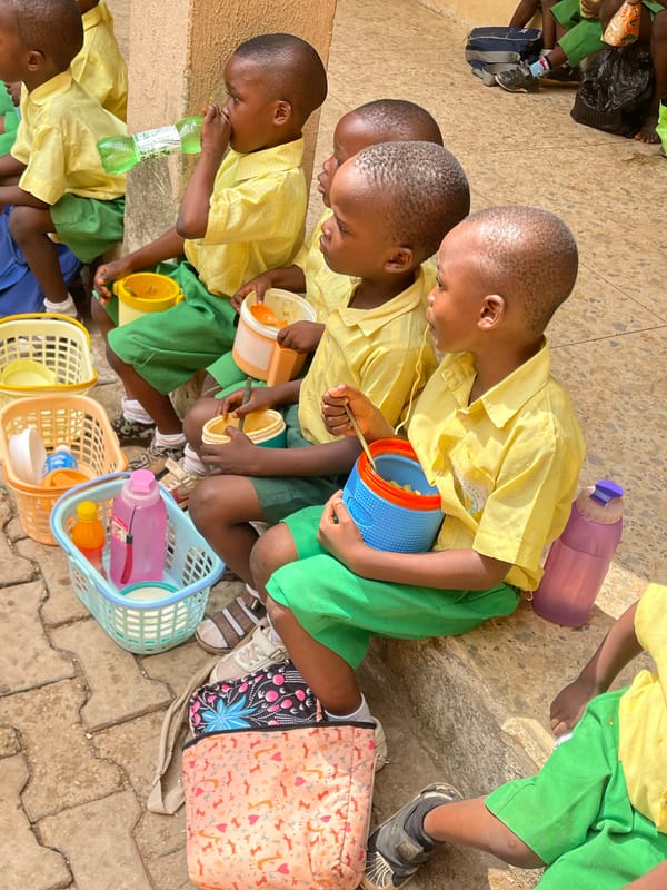 Nigerian schoolchildren enjoy lunch break in Akwanga