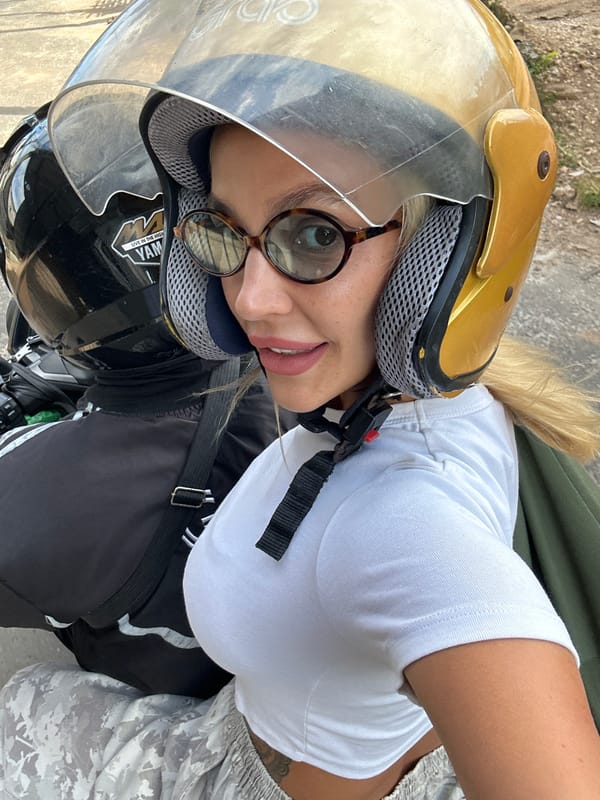Motorcycle selfie in Kuta Selatan with gold helmet