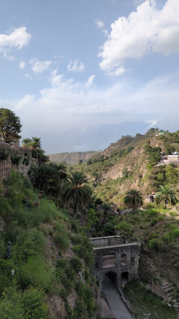 Tourist documents morning visit to historic Kangra Fort complex