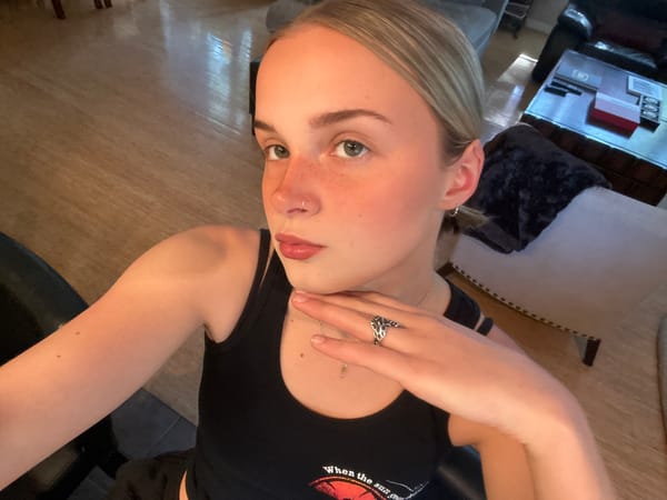 Woman takes upside-down selfie indoors in Whistler
