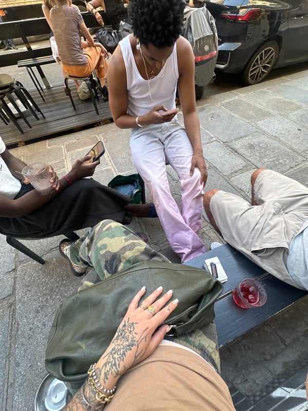 Ordinary street life documented across central Paris during evening hours