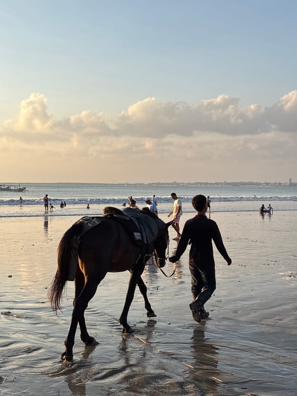 Sunset crowds gather at Kuta Selatan beach Indonesia