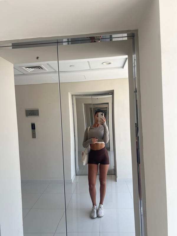 Woman takes mirror selfie in Dubai elevator