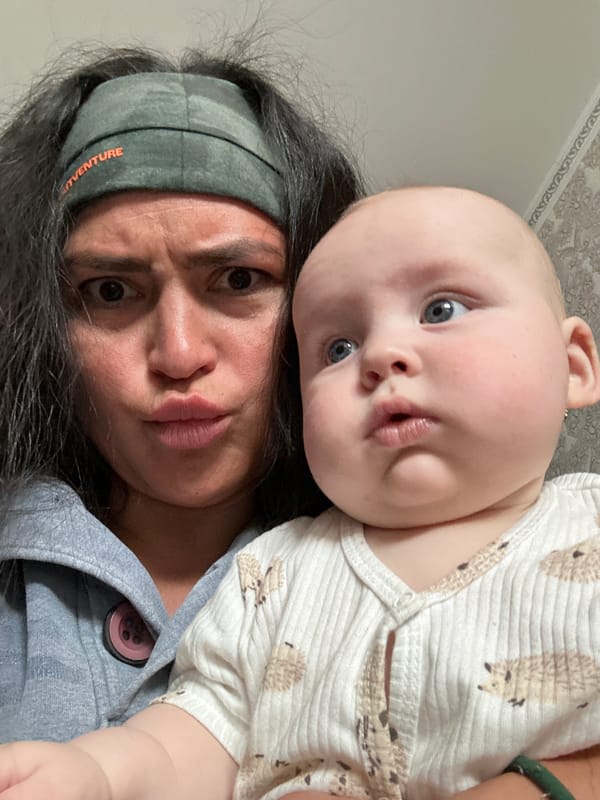 Woman with baby captured in indoor moments in Кемуль, Russia