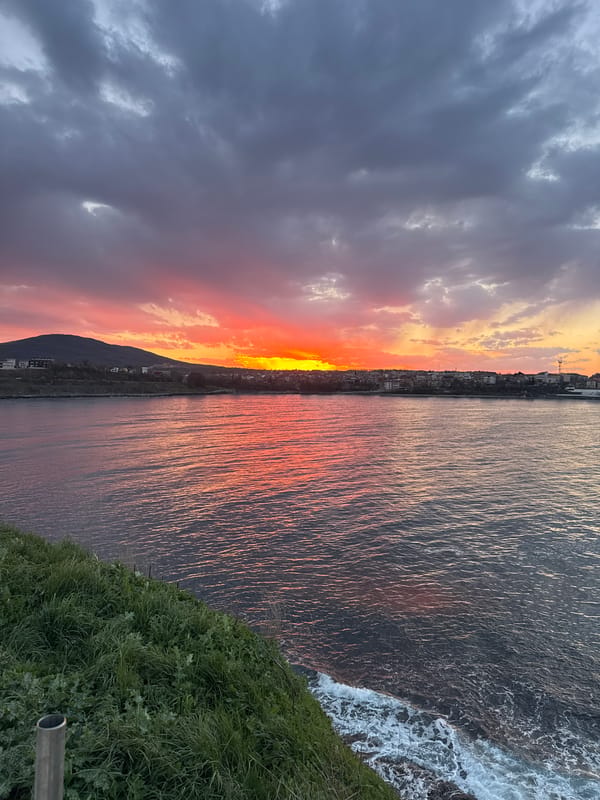 Sunset documented over coastal Tsarevo, Bulgaria with Orthodox cross