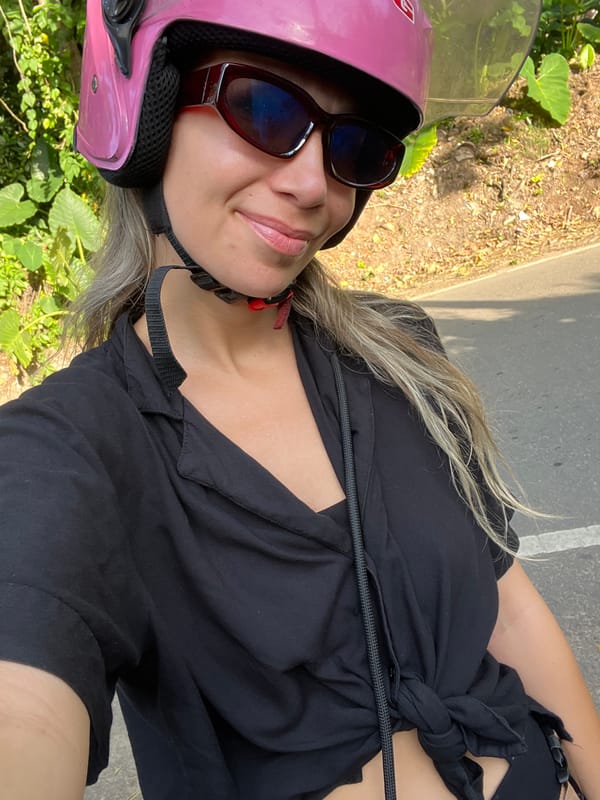 Scooter rider on a rural road in Kathaluwa, Sri Lanka