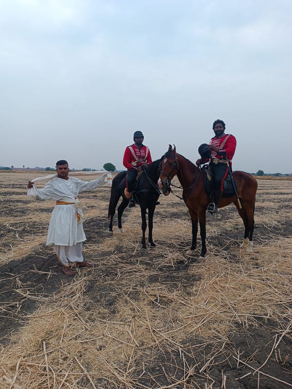 Historical military reenactment unfolds in rural Indian fields