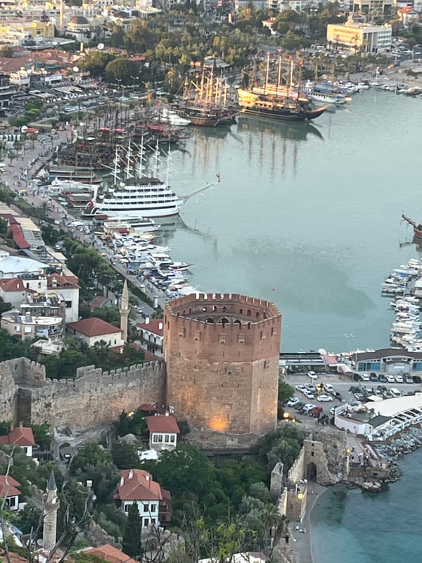 Tourists document scenic views of Turkey's historic Alanya coastline
