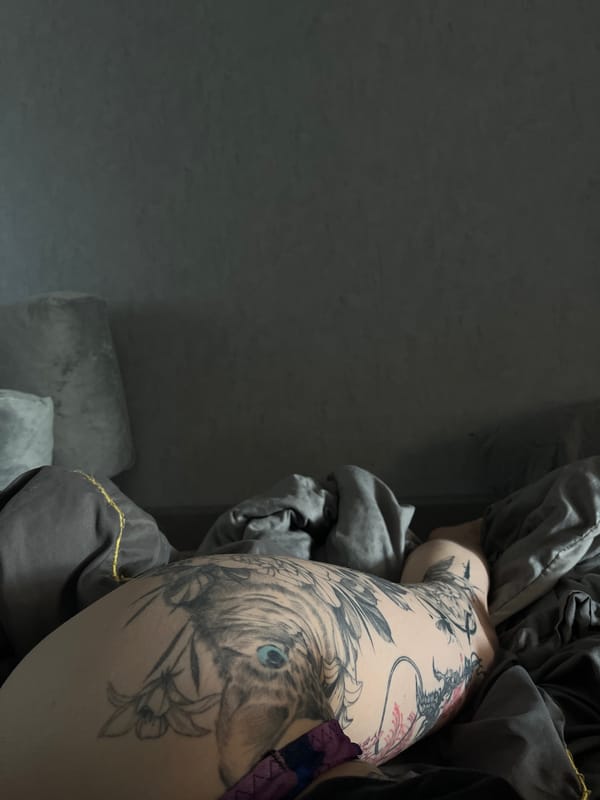 Person spotted with tiger head tattoo featuring blue eyes