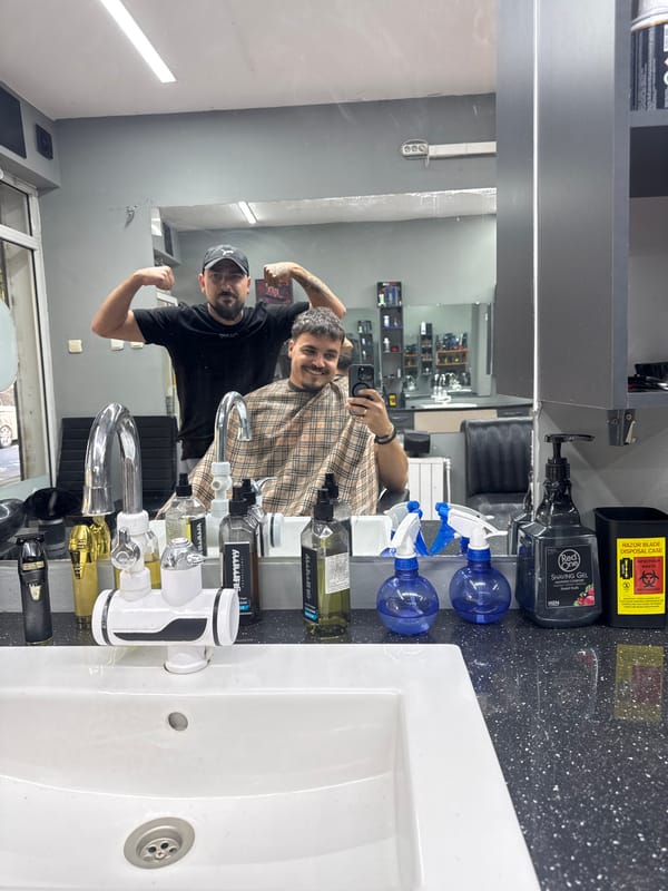 Two men photographed at skull-themed barbershop during morning visit