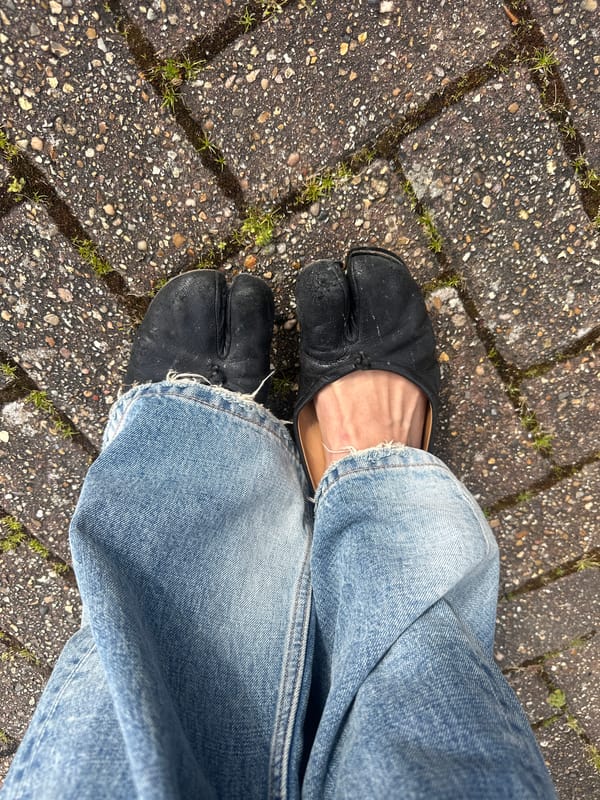 Woman applies makeup indoors in Wealden, UK