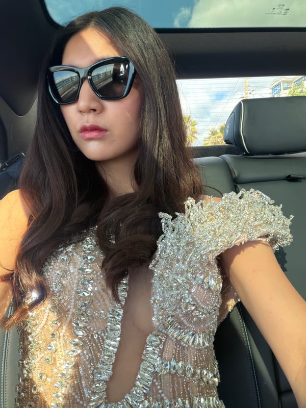 Woman in sequined dress spotted in car in Cannes