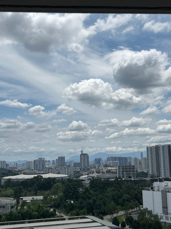 Early morning cloudy skies observed over Kuala Lumpur cityscape