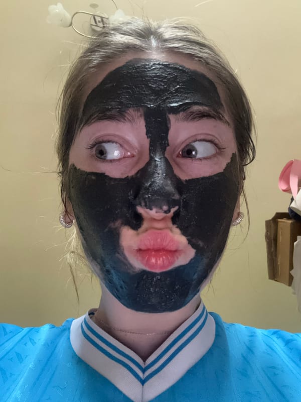 Person in Hungarian jersey makes kissing face with darkened face