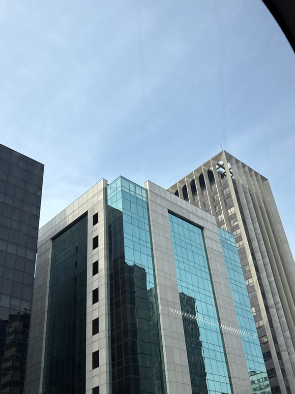 Looking up at São Paulo's downtown skyline, old and new