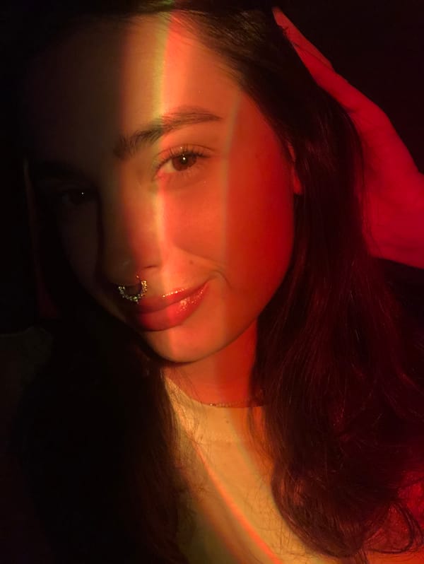 Woman takes colorful selfies in dimly lit Russian interior