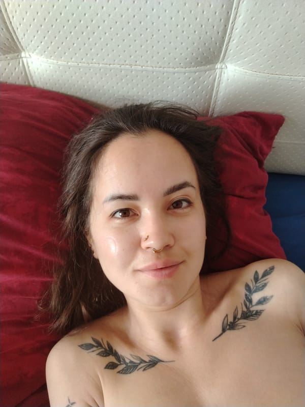 Woman with tattoos observed resting in Noviy, Russia