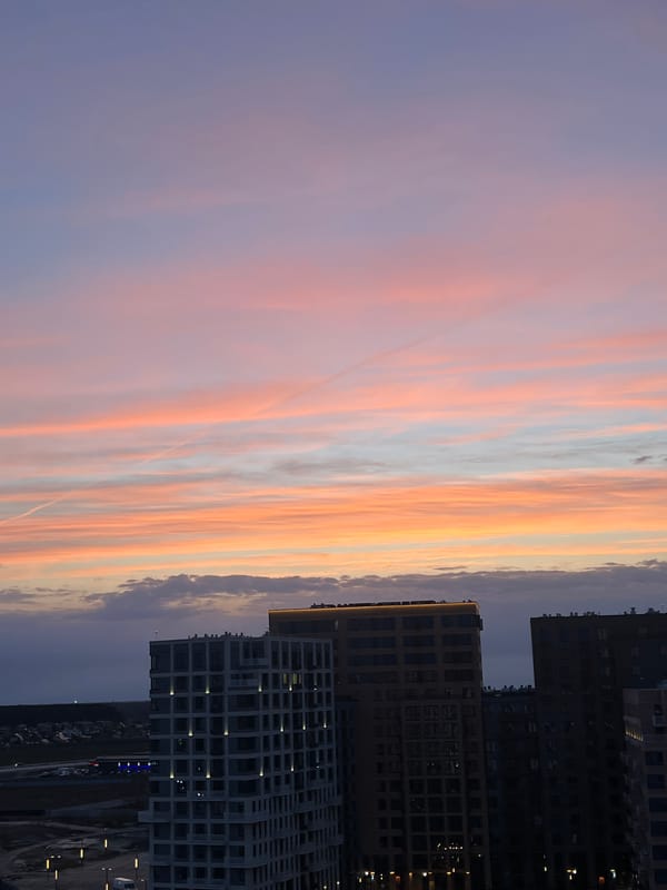 Vibrant sunset illuminates Tyumen urban landscape, Russia