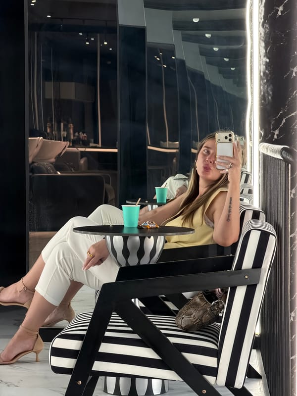 Woman takes selfie in stylish Moscow interior setting