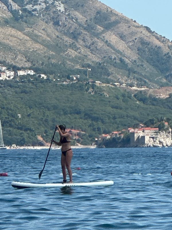 Paddleboarding and boat traffic on the Adriatic near Boreti