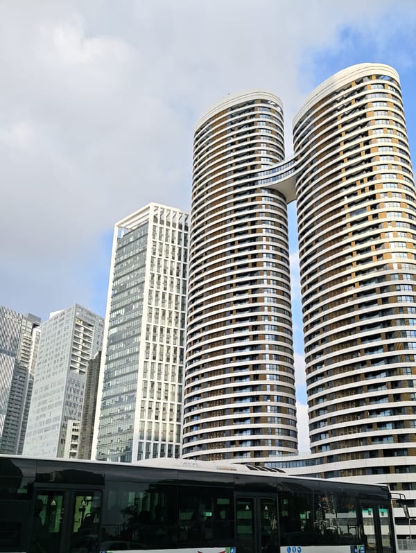 Street-level view of modern Tel Aviv with public transit