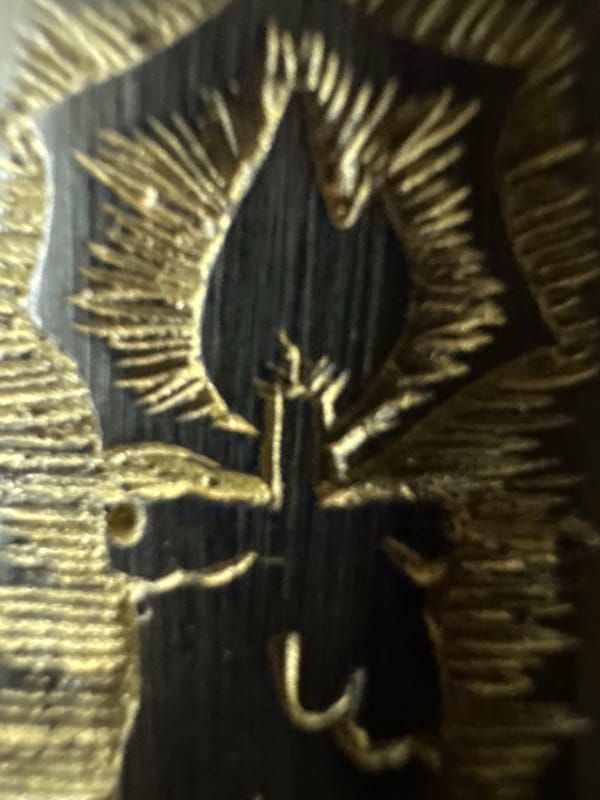 Close-up documentation of golden decorative artwork in Yerevan