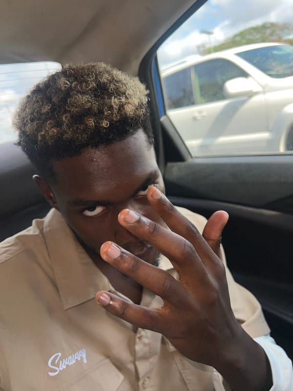 Person touches eye while in vehicle, Lagos Nigeria