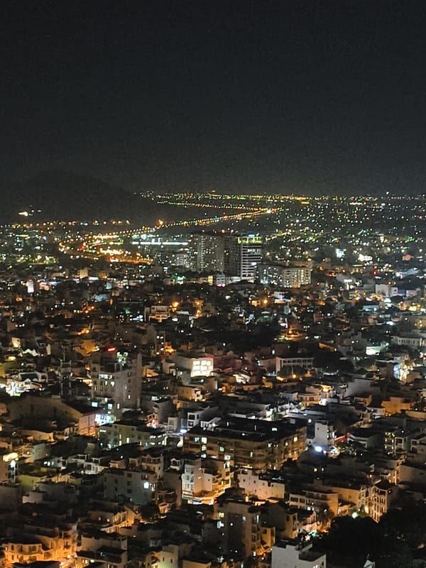 Night photography session captures Nha Trang cityscape from rooftops